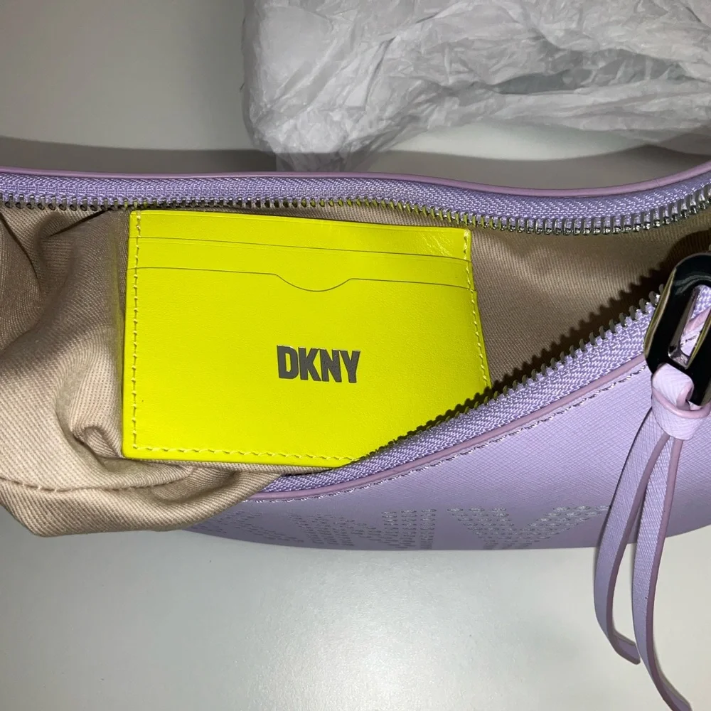 DKNY Essex Saffiano 100% Cow Leather Shoulder Bag in a purple colorway